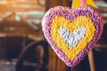 Artificial candle decorated with heart shape to represent the symbol of love and celebrate the...