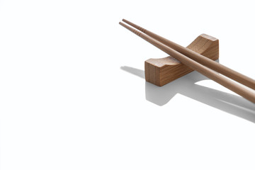 Wooden pairs of chopsticks on white background. cooking culture in Asian countries.