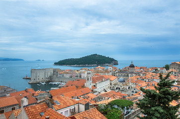 View of red rooftops and blue sea from Dubrovnik city wall, Dubrovnik, Croatia. View from above of old town center.