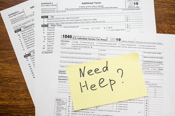 Need help text on sticker with blank 1040 tax return U.S. IRS form. Tax season.