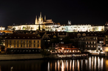 Fototapeta na wymiar View of Prague Castle and Mala Strana at night, Prague, Czech Republic. Prague Castle evening scenery. Hradcany with St Vitus Cathedral after sunset. 