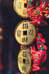 Traditional Chinese new year decorations. The color red means luck. The Chinese golden character means "Good Fortune". These Chinese red decorations have the shape of the traditional Chinese lantern