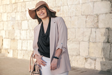 Plus size model wearing fashion clothes in city street