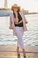 Plus size model wearing fashion clothes in city street