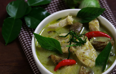 The green curry serving in white bowl