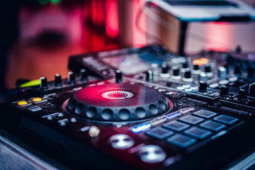 Fototapeta na wymiar DJ playing music at mixer club. Closeup. Party.