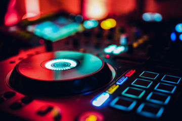 Obraz na płótnie Canvas DJ playing music at mixer club. Closeup. Party.