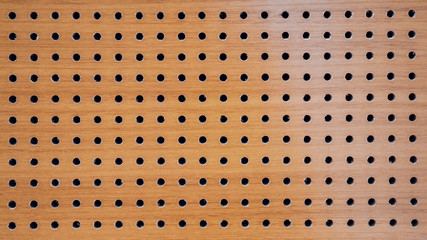 Wood panel with holes texture