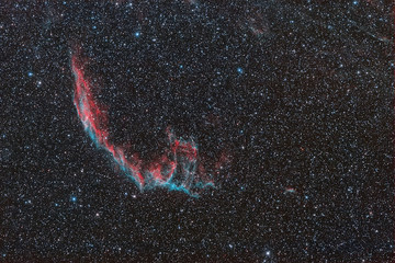 Photo of a cosmic nebula taken through a telescope. cosmic nebula NGC 6960. Space nebula between...