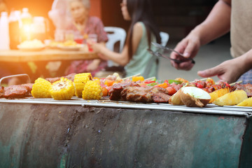Barbeque Grill Street Food in thailand,Eat outdoors in a happy family.