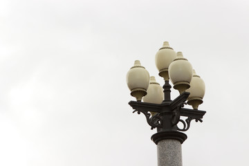 retro classicism modern street lamp on white background. round shades, four bulbs