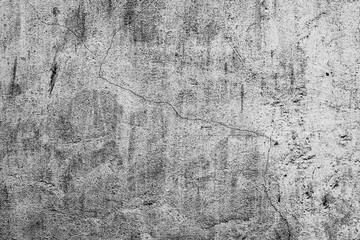 Texture of a concrete wall with cracks and scratches which can be used as a background