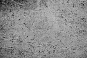 Texture of a concrete wall with cracks and scratches which can be used as a background