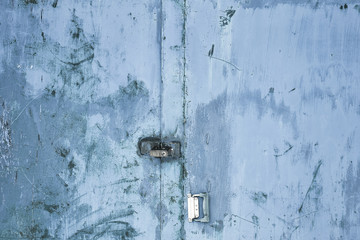 Metal texture, rusty metal with peeling paint, pieces of metal with welds. Background, copy space.