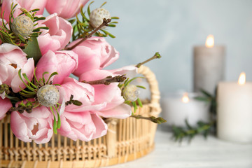 Beautiful bouquet with spring pink tulips on table, closeup