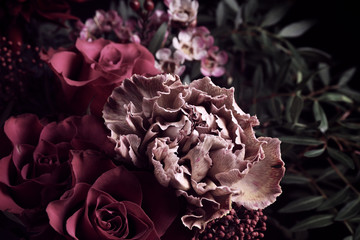 Beautiful bouquet of different flowers on black background, closeup. Floral card design with dark vintage effect