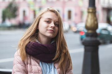Obraz premium Pretty blond teenage girl on an urban walk, close up outdoor portrait