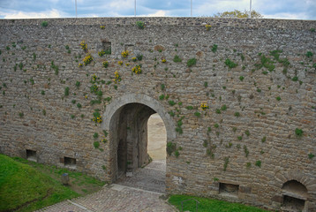 Big stone walls and gate at Dinan fortress, France