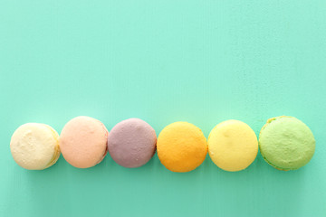 colorful macaron or macaroon over pastel blue background
