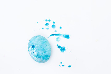 Cute little girl painting Easter eggs