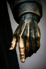 Hand of bronze statue