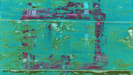 background of brightly painted metal wall of a garage in green, blue and purple colors with scratches and rust