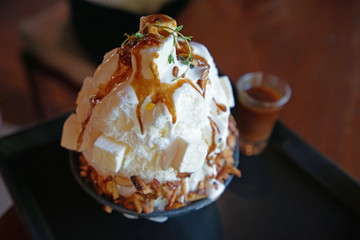 Close up Salted Caramel with cashew nuts Bingsu ,Korean shaved ice dessert