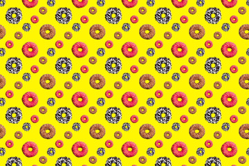 Pattern of pink and chocolate donuts on bright yellow background top view, tasty doughnuts backdrop, colorful sweet dessert wallpaper, repeating decorative ornament, delicious cake art design