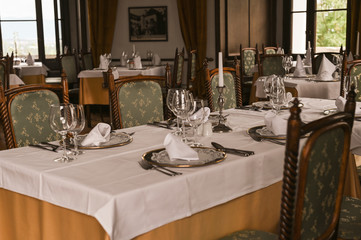 Interior of a classic restaurant in an old castle. Traveling in Europe. Served tables and antiquity