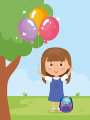 baby girl smiling with helium balloon in hand
