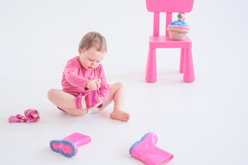 Little girl dresses pink gaiters