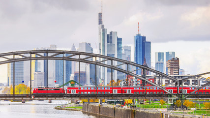  train ride in Frankfurt with skyscrapers in the background - obrazy, fototapety, plakaty