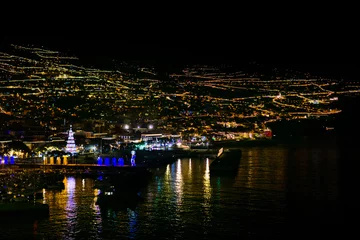 Foto op Plexiglas Funchal in Madeira, Portugal, with many lights at night, view from the sea © Angela Rohde