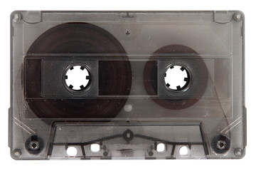 A compact audio cassette in a transparent enclosure is insulated against.