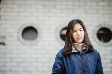 Asian women wear masks to protect against dust and germs.