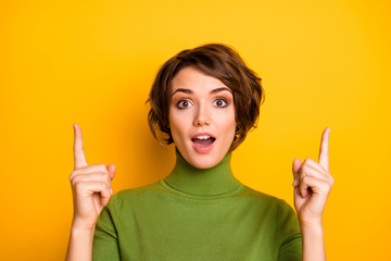 Close up photo of crazy astonished girl promoter point index finger up copyspace present incredible...