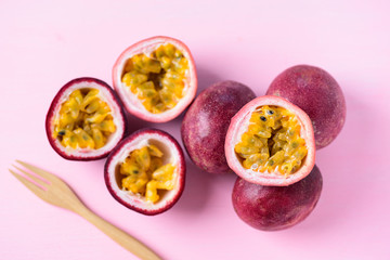 Fresh passion fruit on pink background, top view