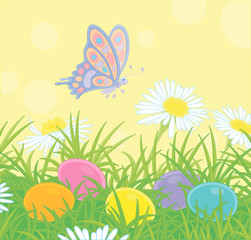 Small brightly colored butterfly flitting over wildflowers and decorated Easter eggs among thick green grass on a sunny spring day, vector cartoon illustration