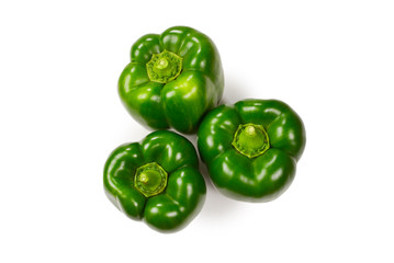 Group of green bell peppers isolated on white background.