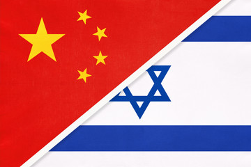 People's Republic of China or PRC vs Israel national flag from textile. Relationship between two asian countries.