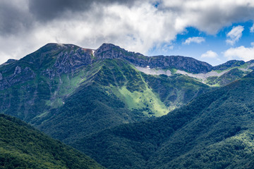 Beautiful green mountains and cloudy sky