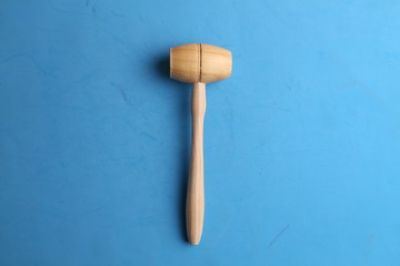 small wooden mallet made of pine wood