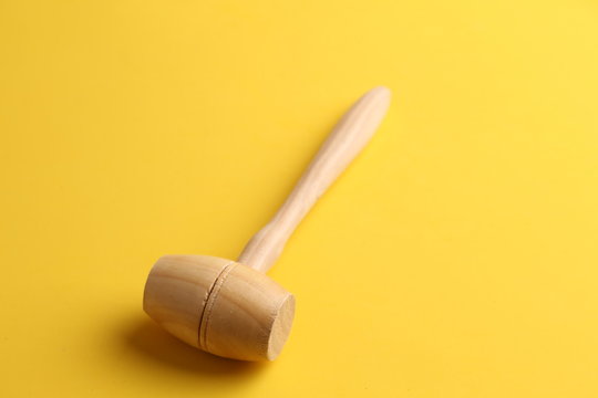 small wooden mallet made of pine wood
