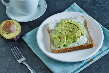 Sandwich of rye bread with avocado and cream cheese