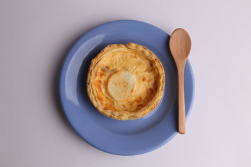 Delicious three cheese quiche in colored background