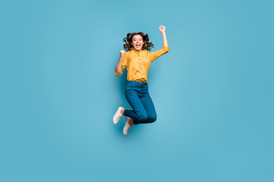 Full length body size view of nice attractive crazy overjoyed cheerful cheery wavy-haired girl jumping having fun rejoicing isolated on bright vivid shine vibrant green blue turquoise color background