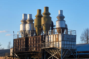 Woodworking industry, rusty used multi cyclone dust collectors. Old sawmill, factory, industrial...