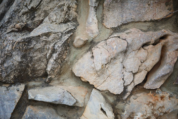 Grey stone wall texture. Rectangular sand-colored stone slabs, background