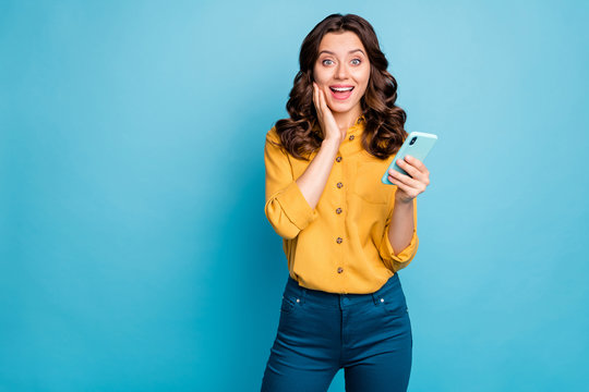 Portrait of her she nice attractive lovely charming cheerful cheery wavy-haired lady using digital device gadget isolated over bight vivid shine vibrant green blue turquoise color background