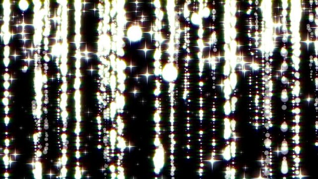 Sparkling light blurs lines of gold particles, golden sparkling glitter fashion strass drop on black background